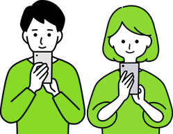 スマホを操作する男女のイメージ